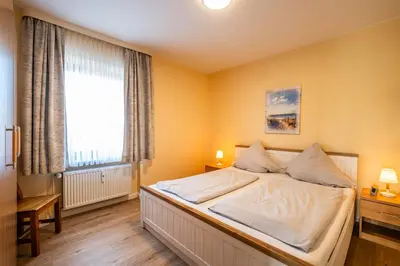 Ein Bett oder Betten in einem Zimmer der Unterkunft Haus Nordseeblick Wohnung 10
