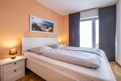 Ein Bett oder Betten in einem Zimmer der Unterkunft Haus Seemeile Wohnung 2 13