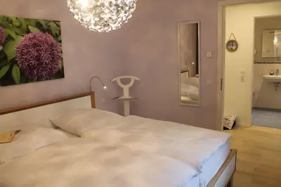 Ein Bett oder Betten in einem Zimmer der Unterkunft Haus Deichkieker Apartment 1 2