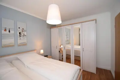 Ein Bett oder Betten in einem Zimmer der Unterkunft Haus Seemeile Wohnung 2 19