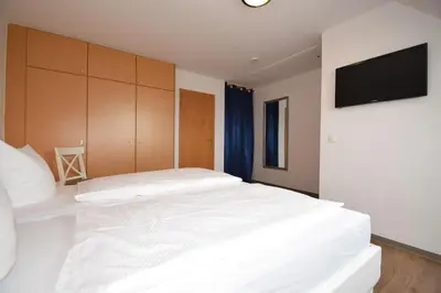 Ein Bett oder Betten in einem Zimmer der Unterkunft Haus Seemeile Wohnung 3 10