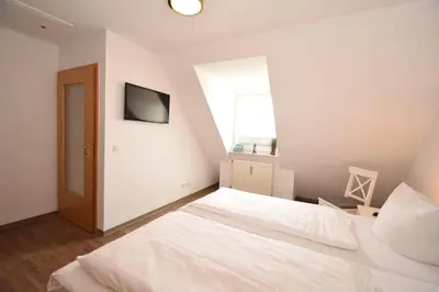 Ein Bett oder Betten in einem Zimmer der Unterkunft Haus Seemeile Wohnung 3 10