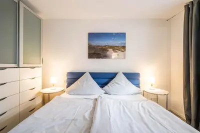 Ein Bett oder Betten in einem Zimmer der Unterkunft Haus Deichkieker Apartment 1 5 Nordlicht