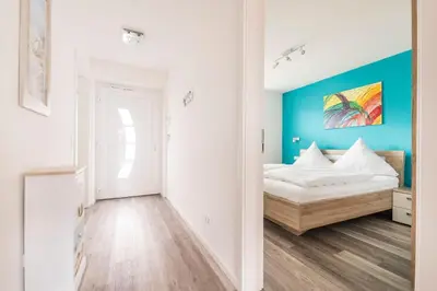 Ein Bett oder Betten in einem Zimmer der Unterkunft Haus Deichkieker Apartment 2 4 Strandoase