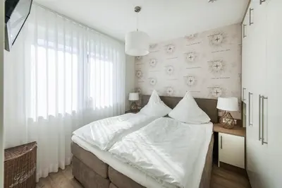 Ein Bett oder Betten in einem Zimmer der Unterkunft Haus Deichkieker Apartment 3 2 Tide
