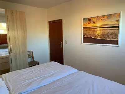 Ein Bett oder Betten in einem Zimmer der Unterkunft Kleine Brise Apartment 1