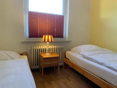 Ein Bett oder Betten in einem Zimmer der Unterkunft Kleine Brise Apartment 1