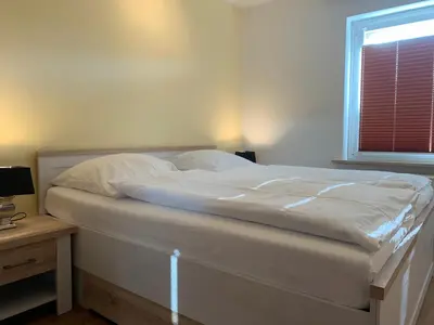 Ein Bett oder Betten in einem Zimmer der Unterkunft Kleine Brise Apartment 2