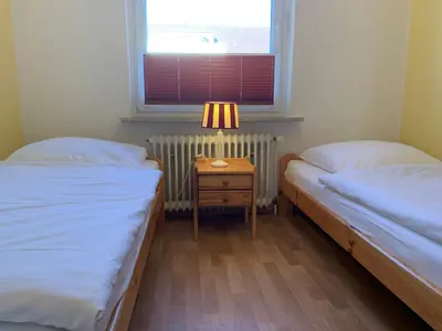 Ein Bett oder Betten in einem Zimmer der Unterkunft Kleine Brise Apartment 3