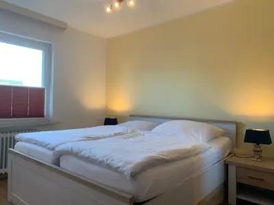 Ein Bett oder Betten in einem Zimmer der Unterkunft Kleine Brise Apartment 4