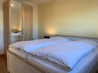 Ein Bett oder Betten in einem Zimmer der Unterkunft Kleine Brise Apartment 6