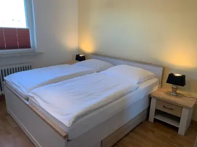 Ein Bett oder Betten in einem Zimmer der Unterkunft Kleine Brise Apartment 7