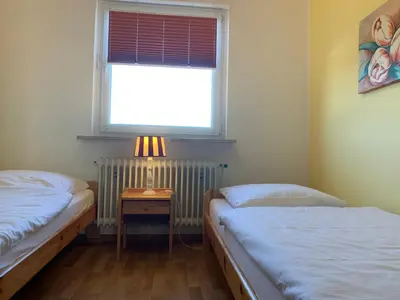 Ein Bett oder Betten in einem Zimmer der Unterkunft Kleine Brise Apartment 7