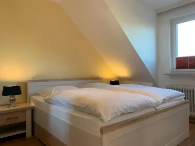 Ein Bett oder Betten in einem Zimmer der Unterkunft Kleine Brise Apartment 9