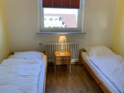 Ein Bett oder Betten in einem Zimmer der Unterkunft Kleine Brise Apartment 9