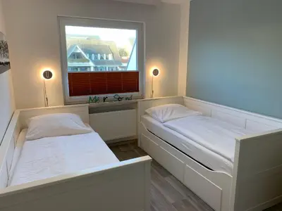 Ein Bett oder Betten in einem Zimmer der Unterkunft Kleine Brise Apartment 11 Bootsmann Stuuv