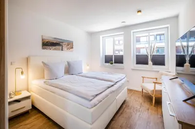 Ein Bett oder Betten in einem Zimmer der Unterkunft Haus Hummerklippe Apartment 4