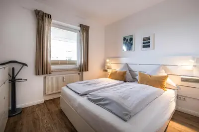 Ein Bett oder Betten in einem Zimmer der Unterkunft Haus Nordseeblick Wohnung 37
