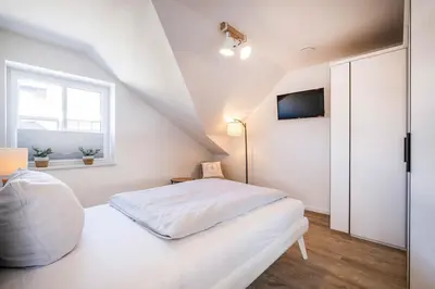 Ein Bett oder Betten in einem Zimmer der Unterkunft Haus Hummerklippe Küstennest Apartment 6