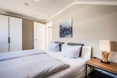 Ein Bett oder Betten in einem Zimmer der Unterkunft Haus Hummerklippe Küstennest Apartment 6