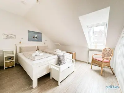 Ein Bett oder Betten in einem Zimmer der Unterkunft Ferienwohnung Seestern