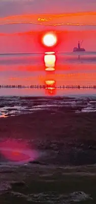 Blick auf den Sonnenuntergang/Sonnenaufgang von der Ferienwohnung aus oder aus der Nähe