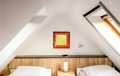 Ein Bett oder Betten in einem Zimmer der Unterkunft Cozy Apartment In Wurster Nordseeküste, With Wifi