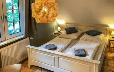 Ein Bett oder Betten in einem Zimmer der Unterkunft Cozy Home In Wingst With Sauna