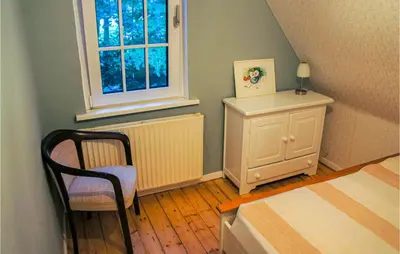 Ein Bett oder Betten in einem Zimmer der Unterkunft Cozy Home In Wingst With Sauna