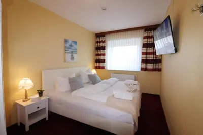 Ein Bett oder Betten in einem Zimmer der Unterkunft Haus Övern Diek Wohnung 4