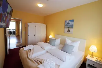 Ein Bett oder Betten in einem Zimmer der Unterkunft Haus Övern Diek Wohnung 4