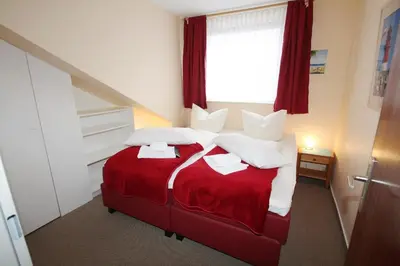 Ein Bett oder Betten in einem Zimmer der Unterkunft Haus am Kurpark Wohnung 26