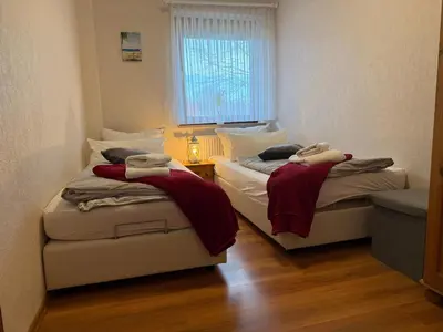 Ein Bett oder Betten in einem Zimmer der Unterkunft Haus am Kurpark Wohnung 12