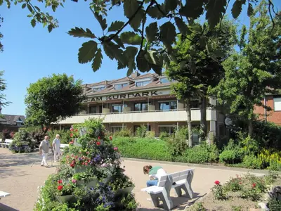 Ein Garten an der Unterkunft Haus am Kurpark Wohnung 13