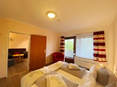 Ein Bett oder Betten in einem Zimmer der Unterkunft Haus am Kurpark Wohnung 14