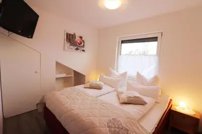 Ein Bett oder Betten in einem Zimmer der Unterkunft Haus am Kurpark Wohnung 21