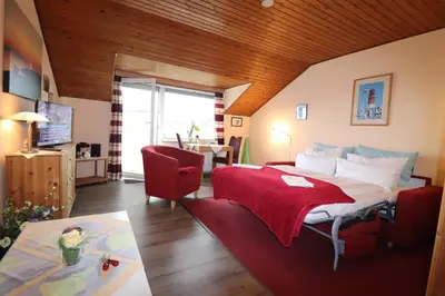 Ein Bett oder Betten in einem Zimmer der Unterkunft Haus am Kurpark Wohnung 23