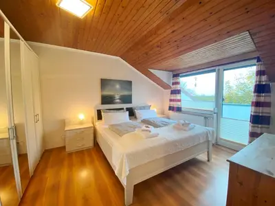 Ein Bett oder Betten in einem Zimmer der Unterkunft Haus am Kurpark Wohnung 24
