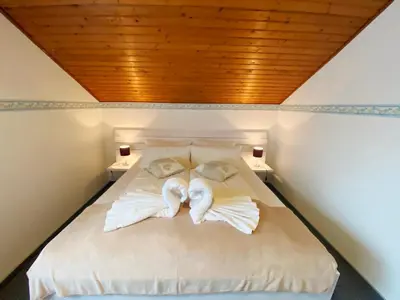 Ein Bett oder Betten in einem Zimmer der Unterkunft Haus am Kurpark Wohnung 25