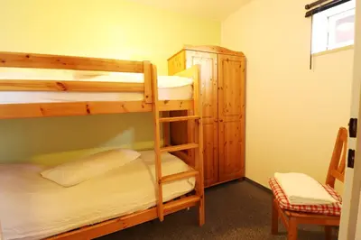 Ein Bett oder Betten in einem Zimmer der Unterkunft Haus am Kurpark Wohnung 25