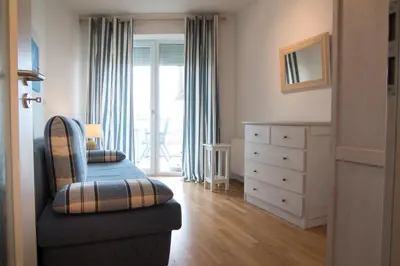Ein Bett oder Betten in einem Zimmer der Unterkunft Strand Palais 11