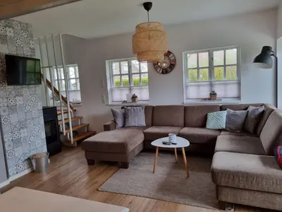 Ein Sitzbereich in der Unterkunft Ferienhaus Norderpiep 54 Grad Nord