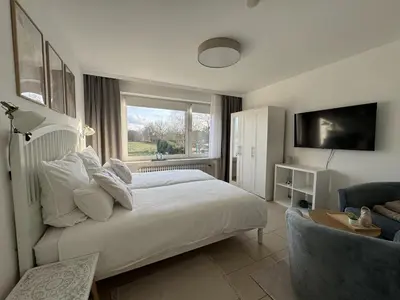 Ein Bett oder Betten in einem Zimmer der Unterkunft CUXTräumer - komplett modernisiert 2026