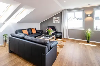 Ein Sitzbereich in der Unterkunft Haus Hummerklippe Apartment 5