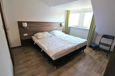 Ein Bett oder Betten in einem Zimmer der Unterkunft Residenz Am Grooten Steen