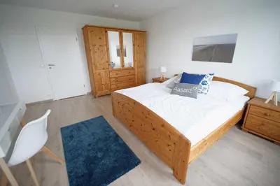 Ein Bett oder Betten in einem Zimmer der Unterkunft Residenz Nordfeldstraße - direkt am Deich