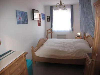 Ein Bett oder Betten in einem Zimmer der Unterkunft Residenz Vogelsand 2