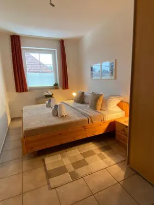 Ein Bett oder Betten in einem Zimmer der Unterkunft Residenz Vogelsand 3