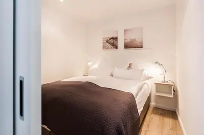 Ein Bett oder Betten in einem Zimmer der Unterkunft Weisse Villa Apartment 1 1 Lagune