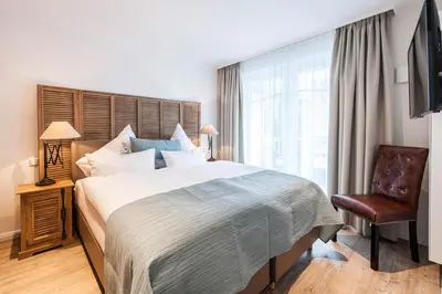 Ein Bett oder Betten in einem Zimmer der Unterkunft Weisse Villa Apartment 1 2 Meerglück